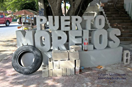 Another Puerto Morelos sign. You will never forget the name of the town again. I assume the old tire is not part of the project. 